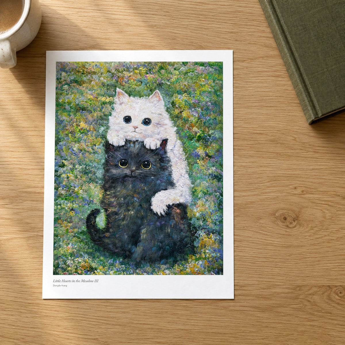 Little Hearts in the Meadow III studio print on a light oak desk