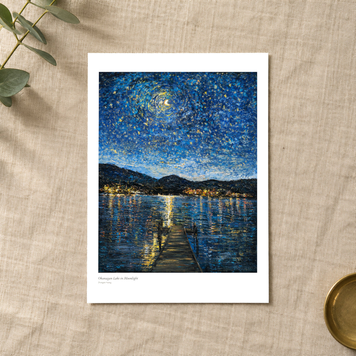 Okanagan Lake in Moonlight studio print with title and signature margin, lying on linen