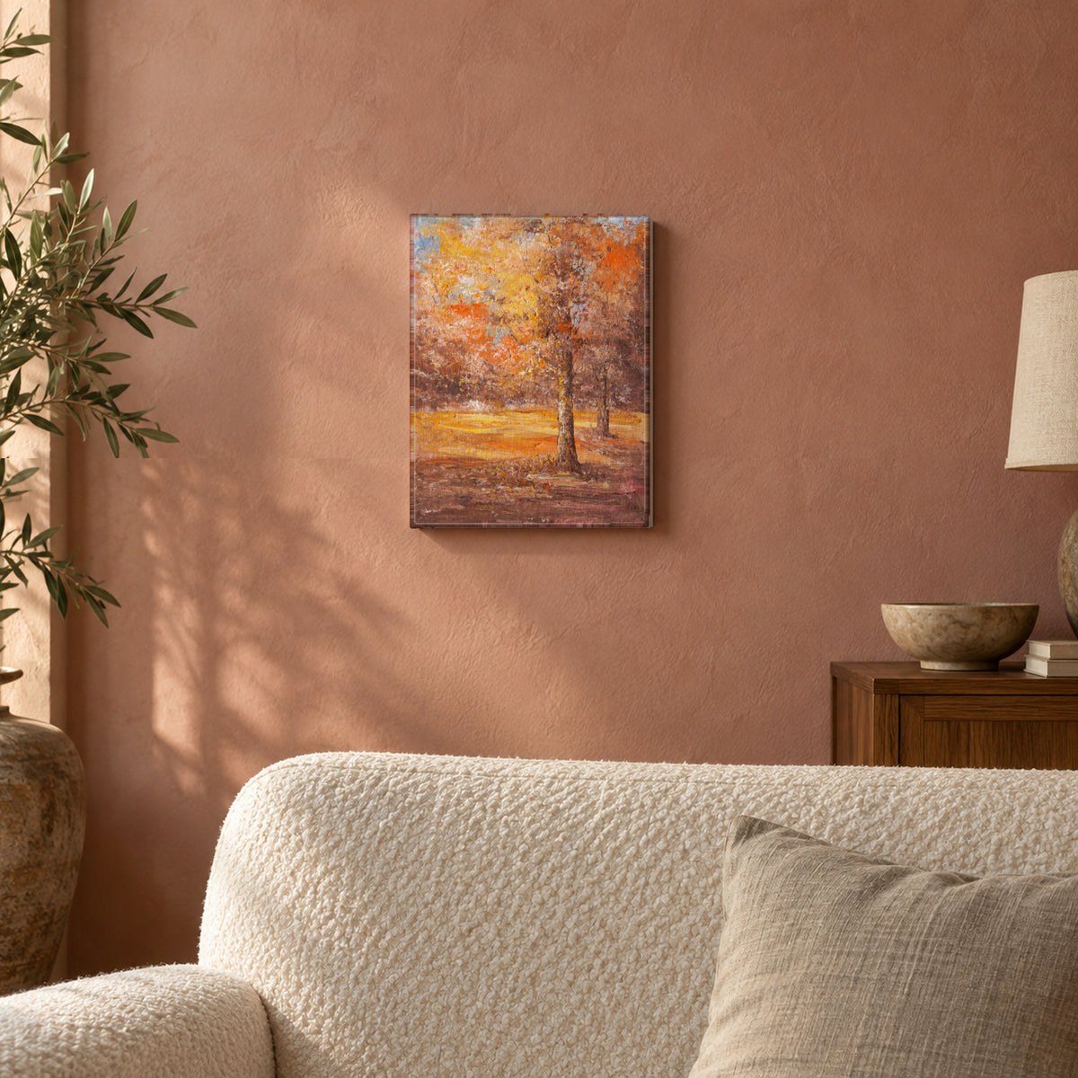 Golden Grove by Yingzhi Chen hanging on a dusty rose plaster wall above a cream bouclé sofa back with a linen cushion