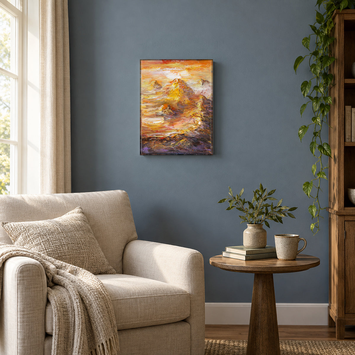 Golden Ridge by Yingzhi Chen hanging on a muted slate-blue painted wall above a reading corner with a linen armchair and a small round side table