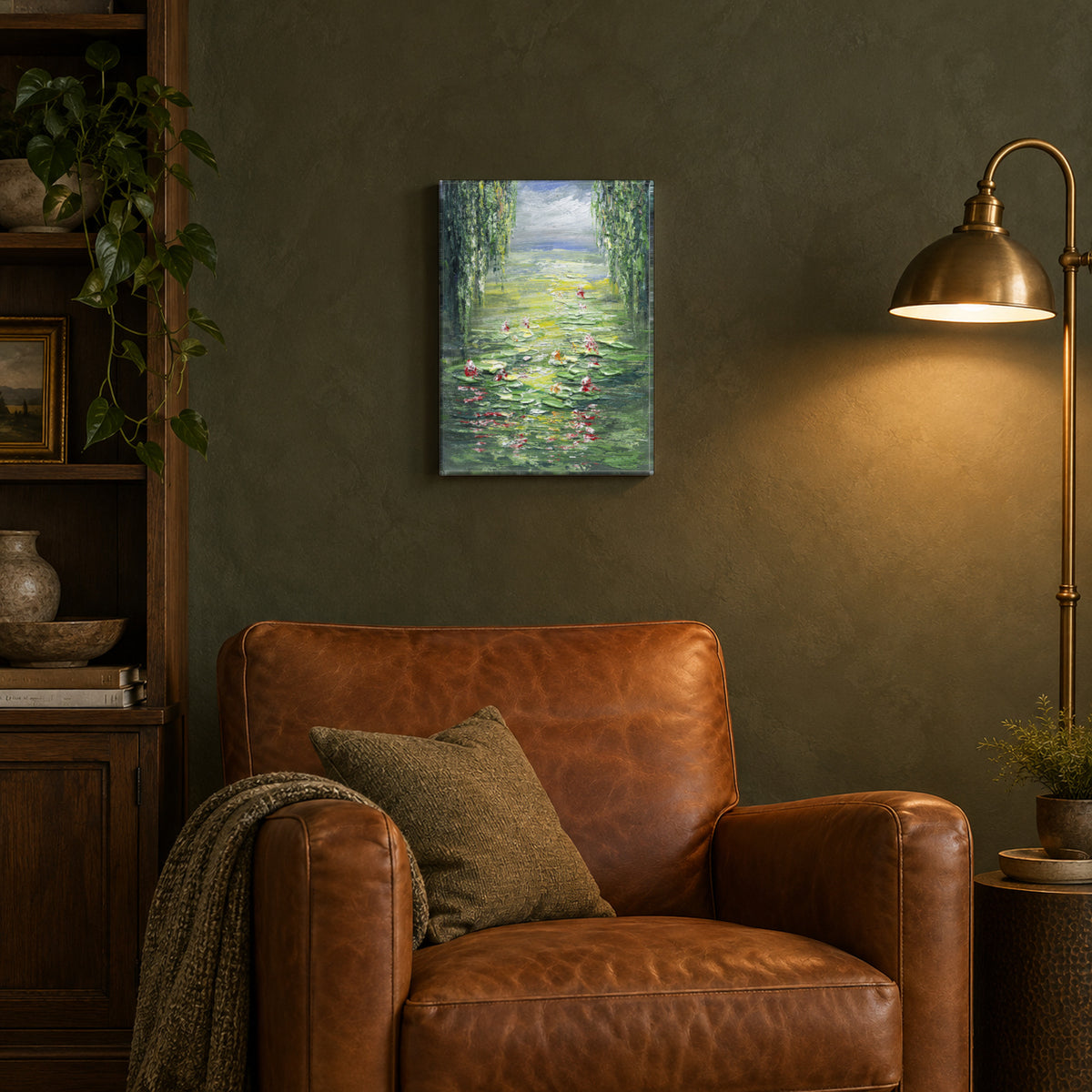 Water Lilies by Yingzhi Chen hanging on a deep olive green limewash wall above a cognac leather armchair