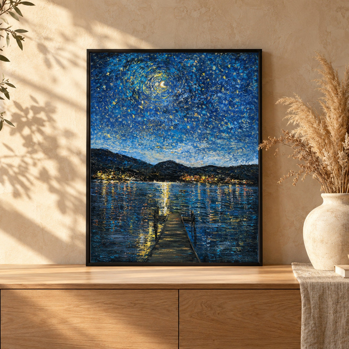 Original painting in a black floater frame on an oak sideboard