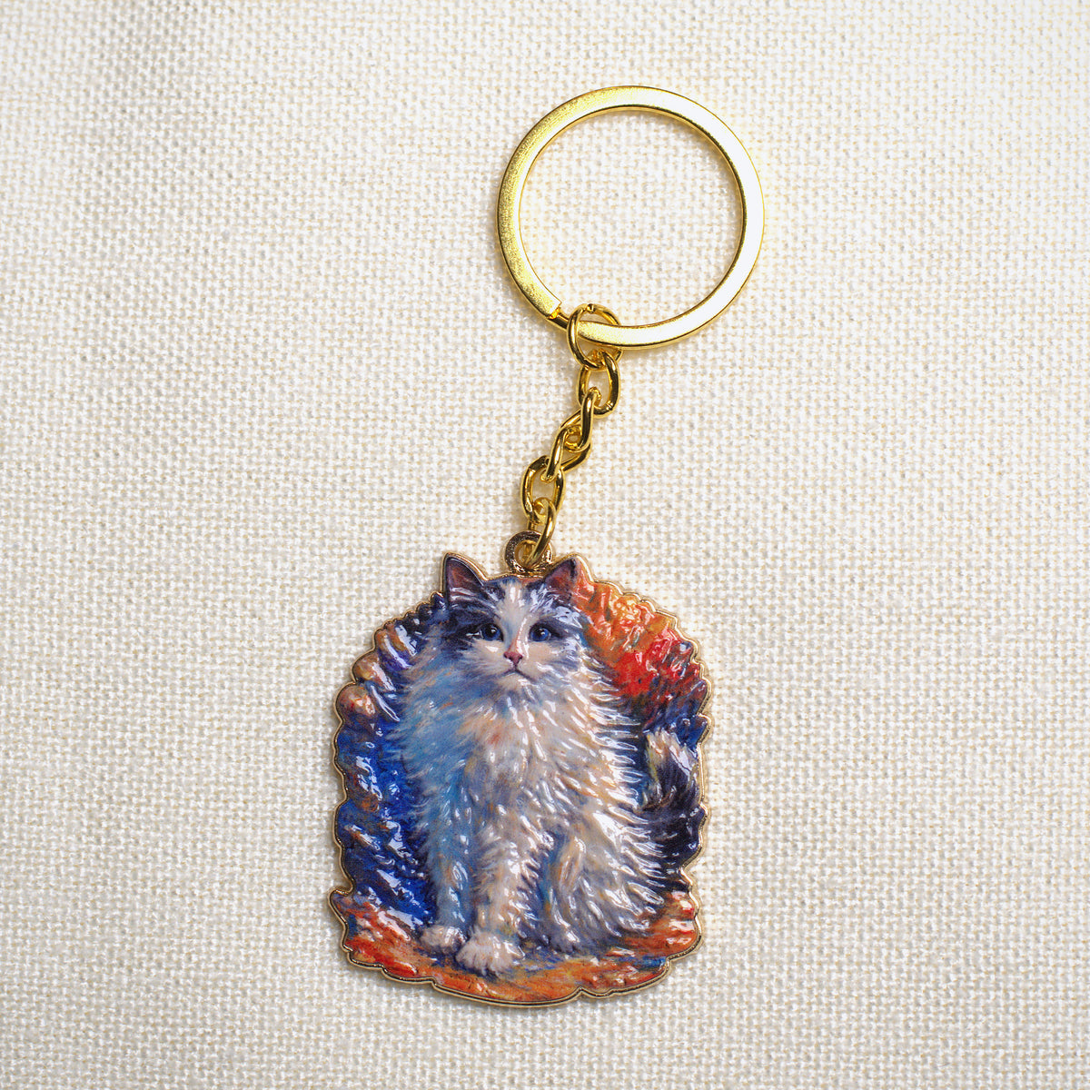 Bunbun sculpted art keychain, front view on linen
