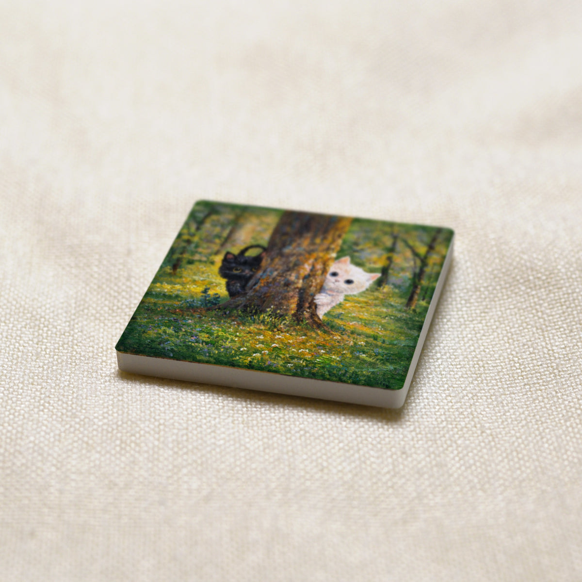 Hide and Seek art magnet at an angle, showing the stone edge