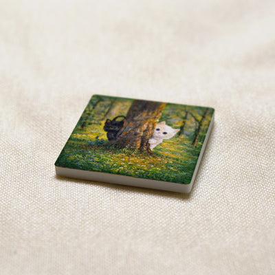Hide and Seek art magnet at an angle, showing the stone edge