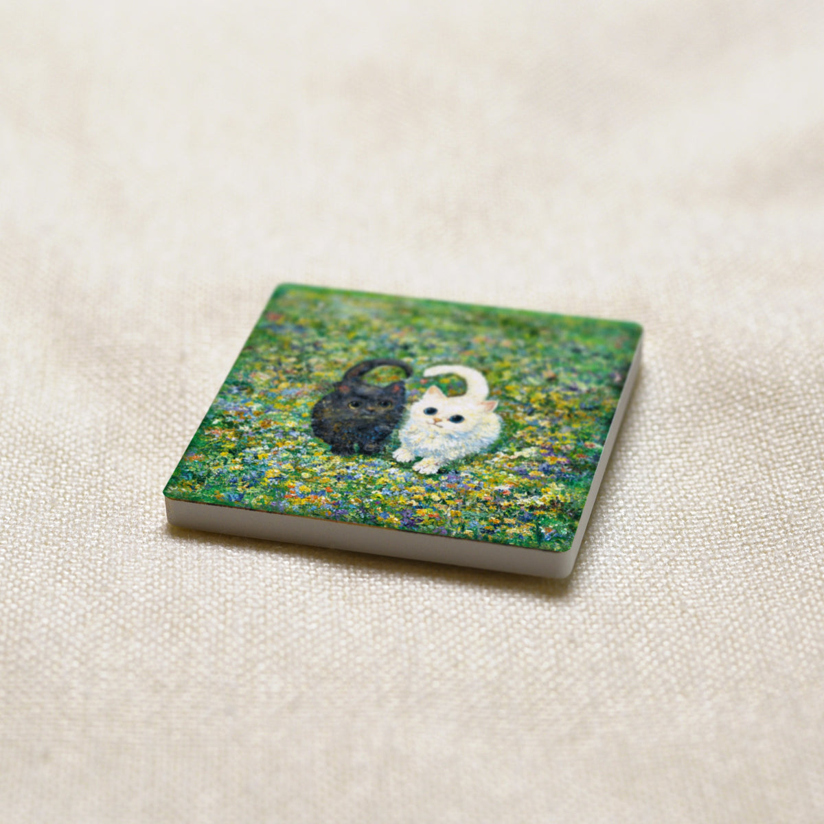 Little Hearts in the Meadow art magnet at an angle, showing the stone edge