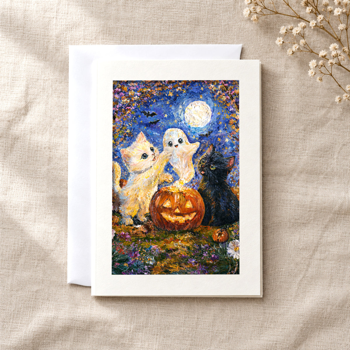 A Little Halloween Magic art card: a folded 5×7 card with the artwork in a centred window, with a white envelope