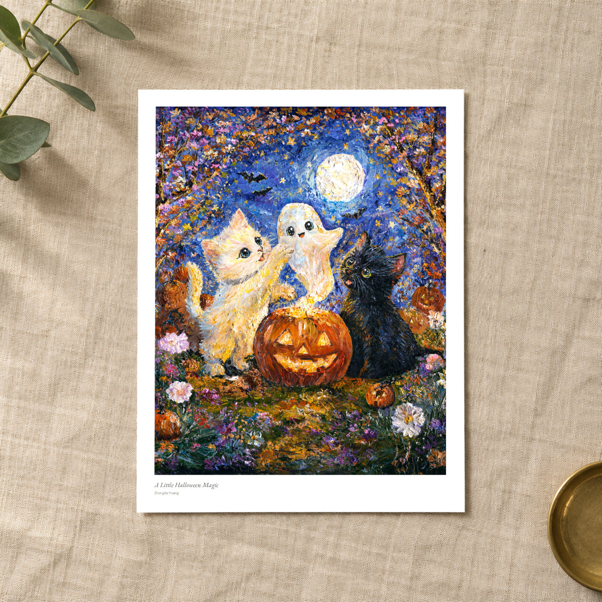 A Little Halloween Magic studio print with title and signature margin, lying on linen