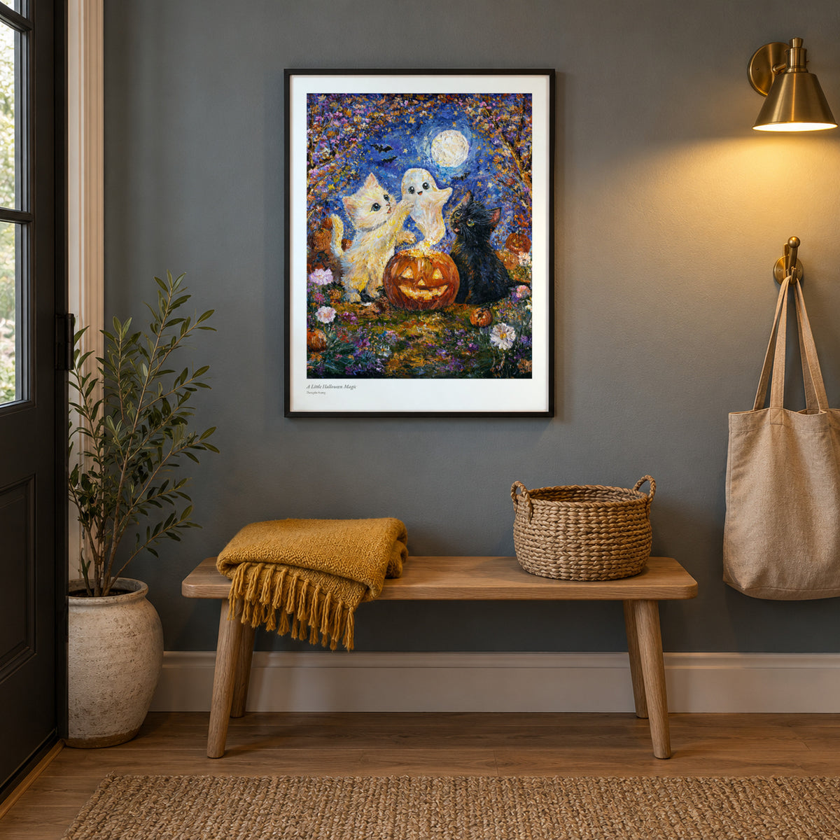 A Little Halloween Magic studio print, 17 × 22 in, in a black frame in an entryway (frame not included)
