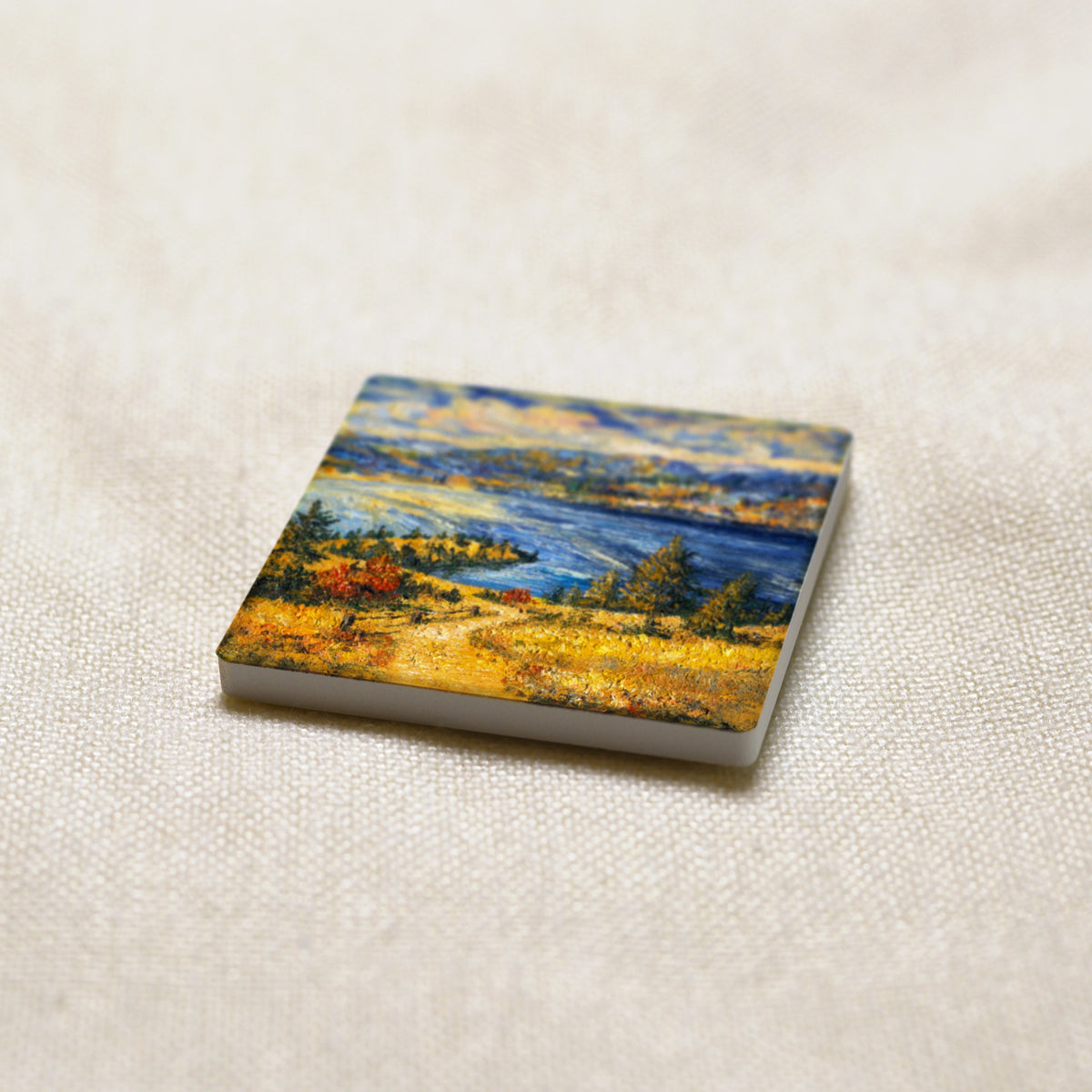 Okanagan Lake from the Heights art magnet at an angle, showing the stone edge