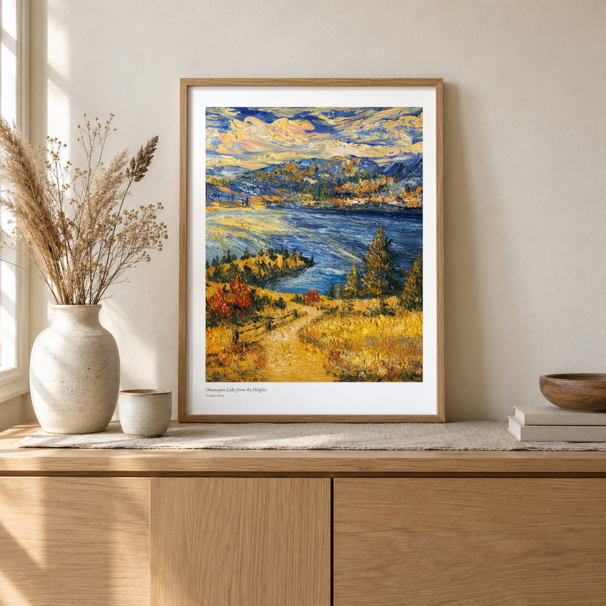 Okanagan Lake from the Heights studio print, 17 × 22 in, in a light oak frame on a sideboard (frame not included)