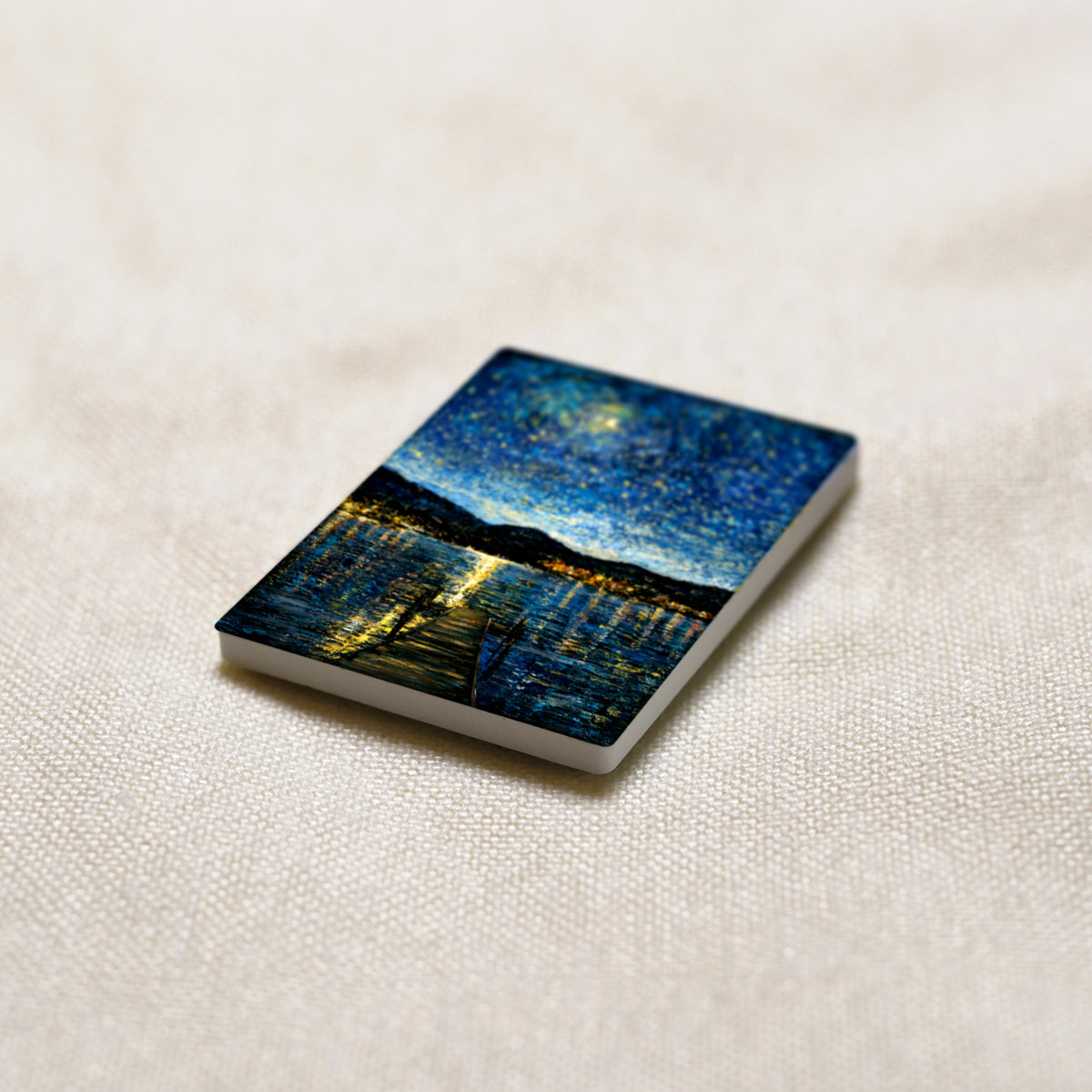 Okanagan Lake in Moonlight art magnet at an angle, showing the stone edge