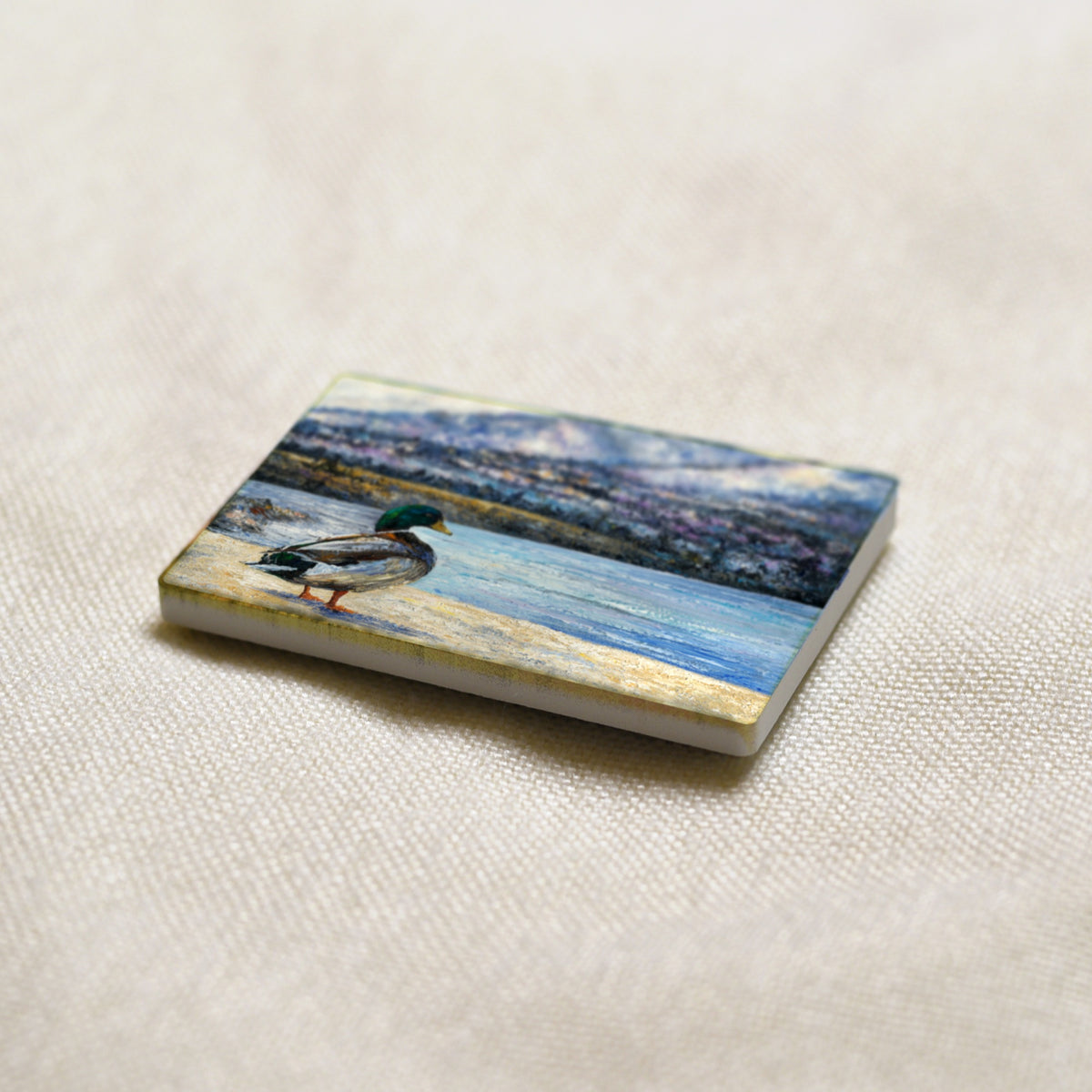 Okanagan Lake at the Edge of Winter art magnet at an angle, showing the stone edge