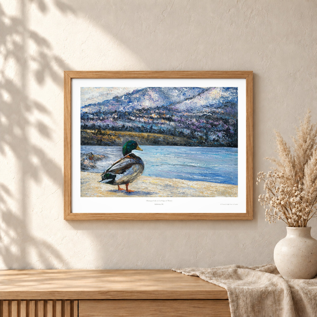 Okanagan Lake at the Edge of Winter art print shown in an oak frame on a wall (frame not included)