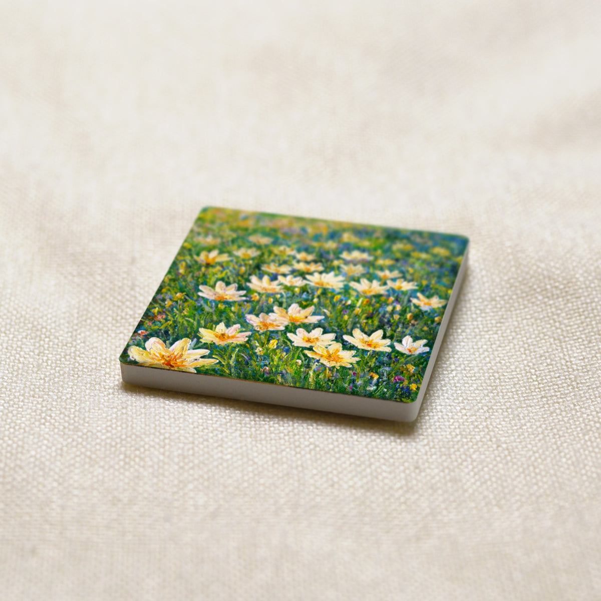 Rain Lilies art magnet at an angle, showing the stone edge