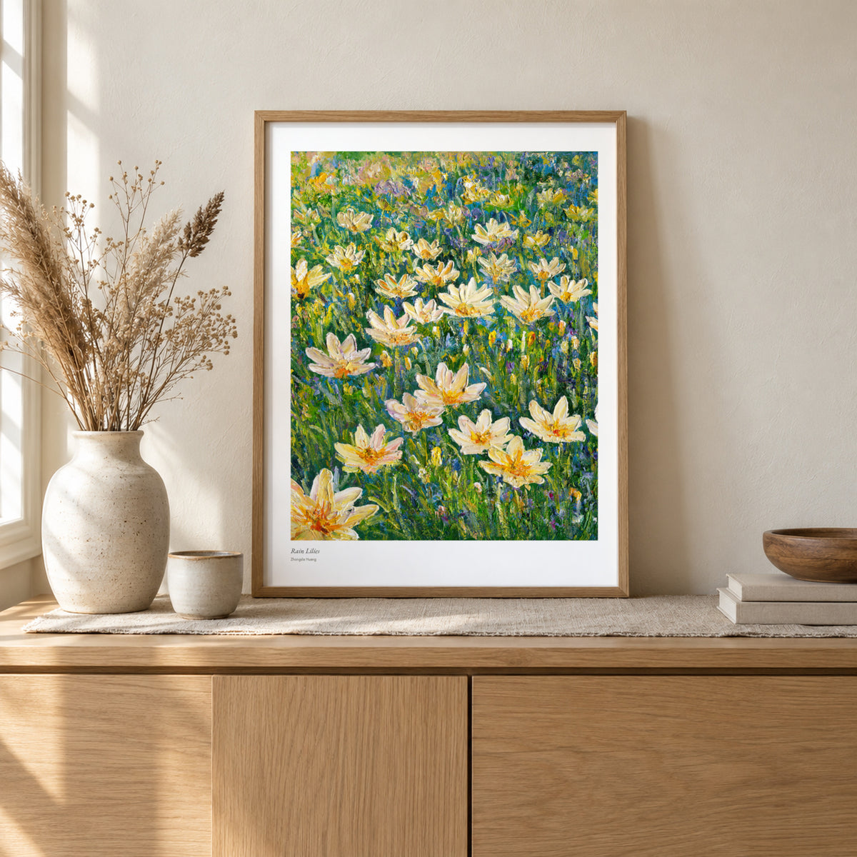 Rain Lilies studio print, 17 × 22 in, in a light oak frame on a sideboard (frame not included)