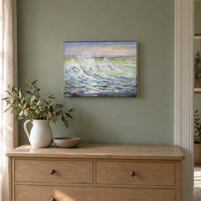 Breaking Waves by Yingzhi Chen hanging on a sage green painted wall above a pale oak dresser with a white ceramic jug of fresh greenery