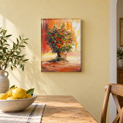 Ember Bouquet II by Yingzhi Chen hanging on a pale butter-yellow plaster wall above a light wood dining table edge with a bowl of lemons