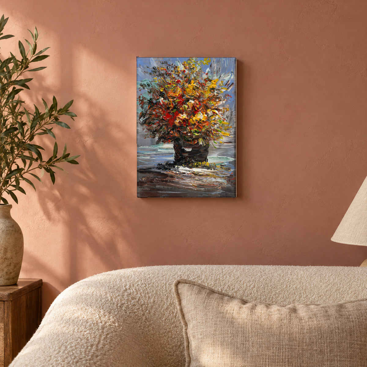 Ember Bouquet by Yingzhi Chen hanging on a dusty rose plaster wall above a cream bouclé sofa back with a linen cushion