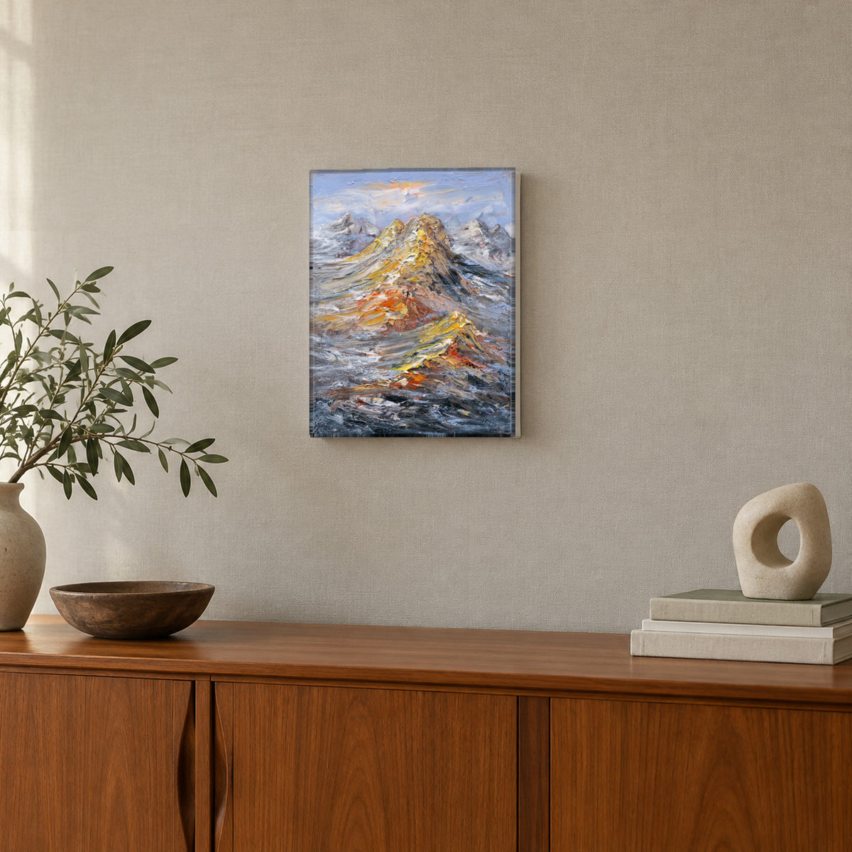Rising Ridge by Yingzhi Chen hanging on a light warm-grey linen-textured wall above a mid-century teak credenza with a small sculpture and books
