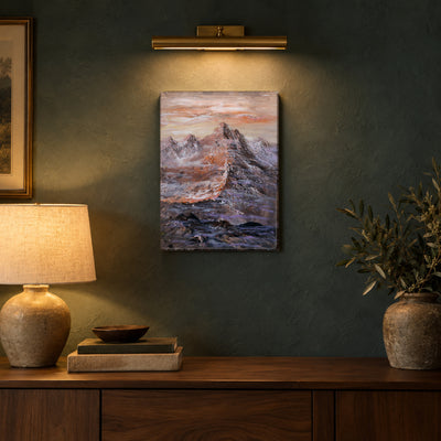 Silent Ridge by Yingzhi Chen hanging on a deep teal-grey limewash wall above a walnut console with a ceramic lamp and a stack of books